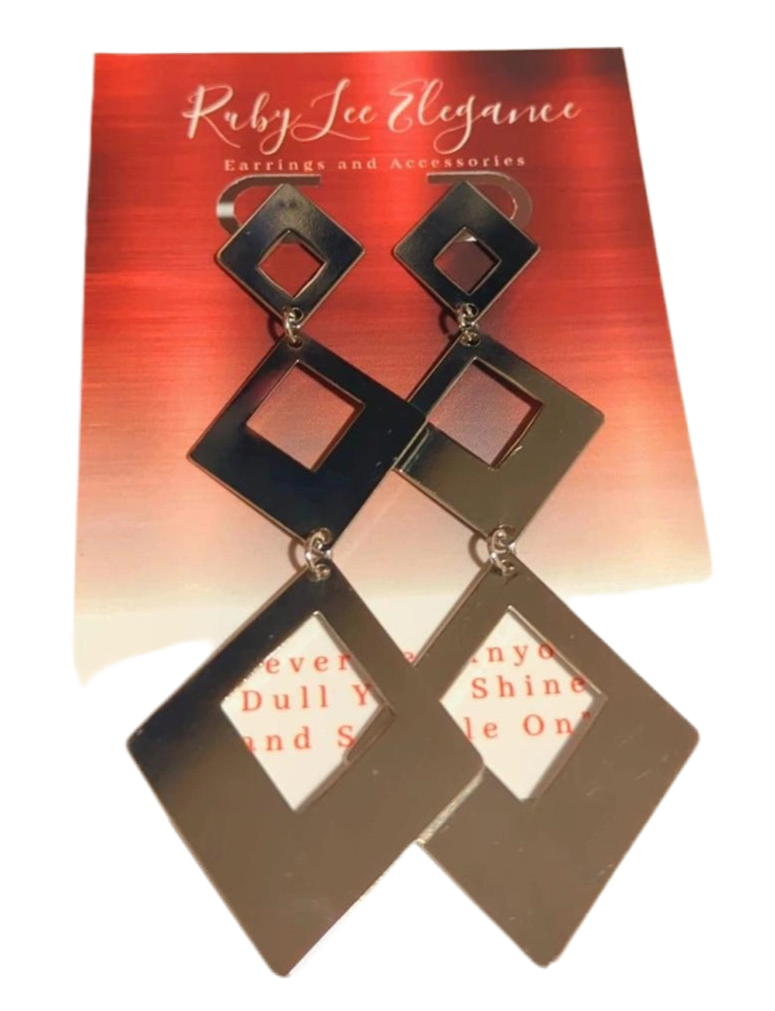 Gold square-shaped earrings on a Ruby Lee Elegance card with red and white design.
