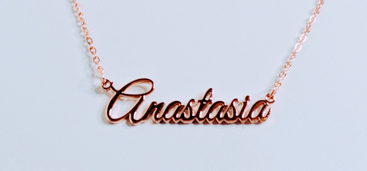 Rose gold 'Anastasia' necklace on a light blue background