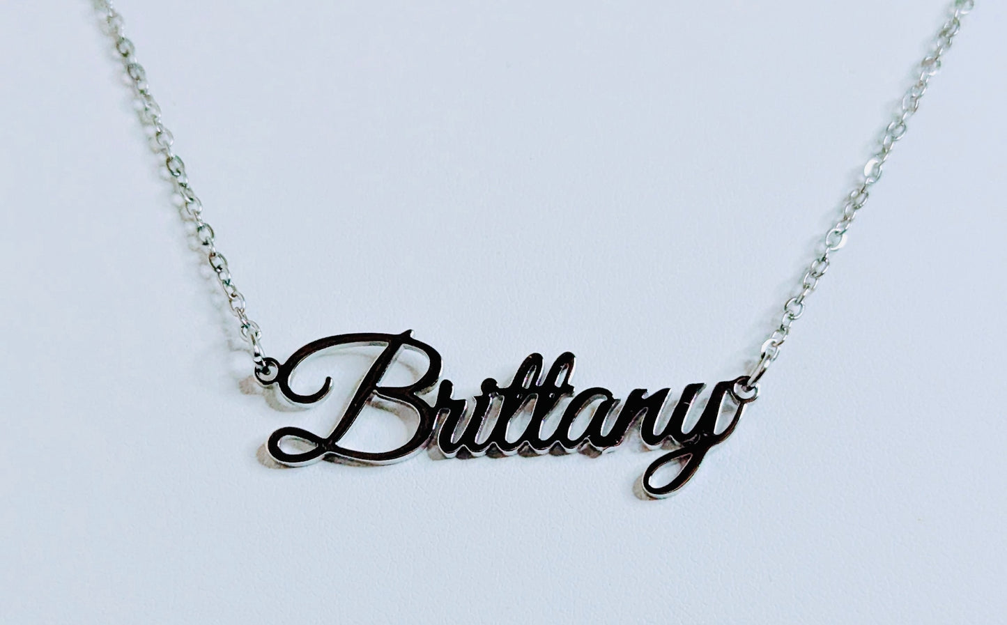Necklace with 'Brittany' pendant on a light gray background