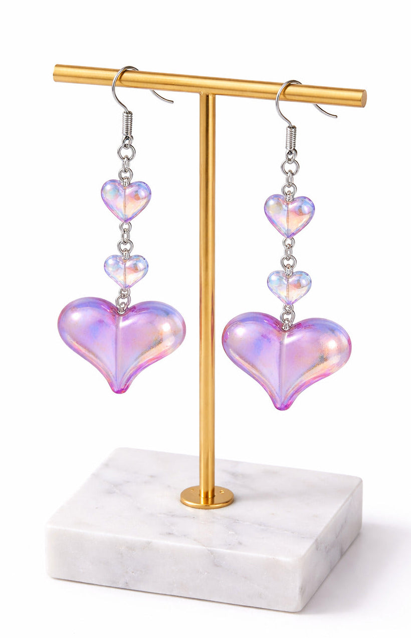 Iridescent Love glow earrings with cascading pink-lavender heart drops on silver hooks.