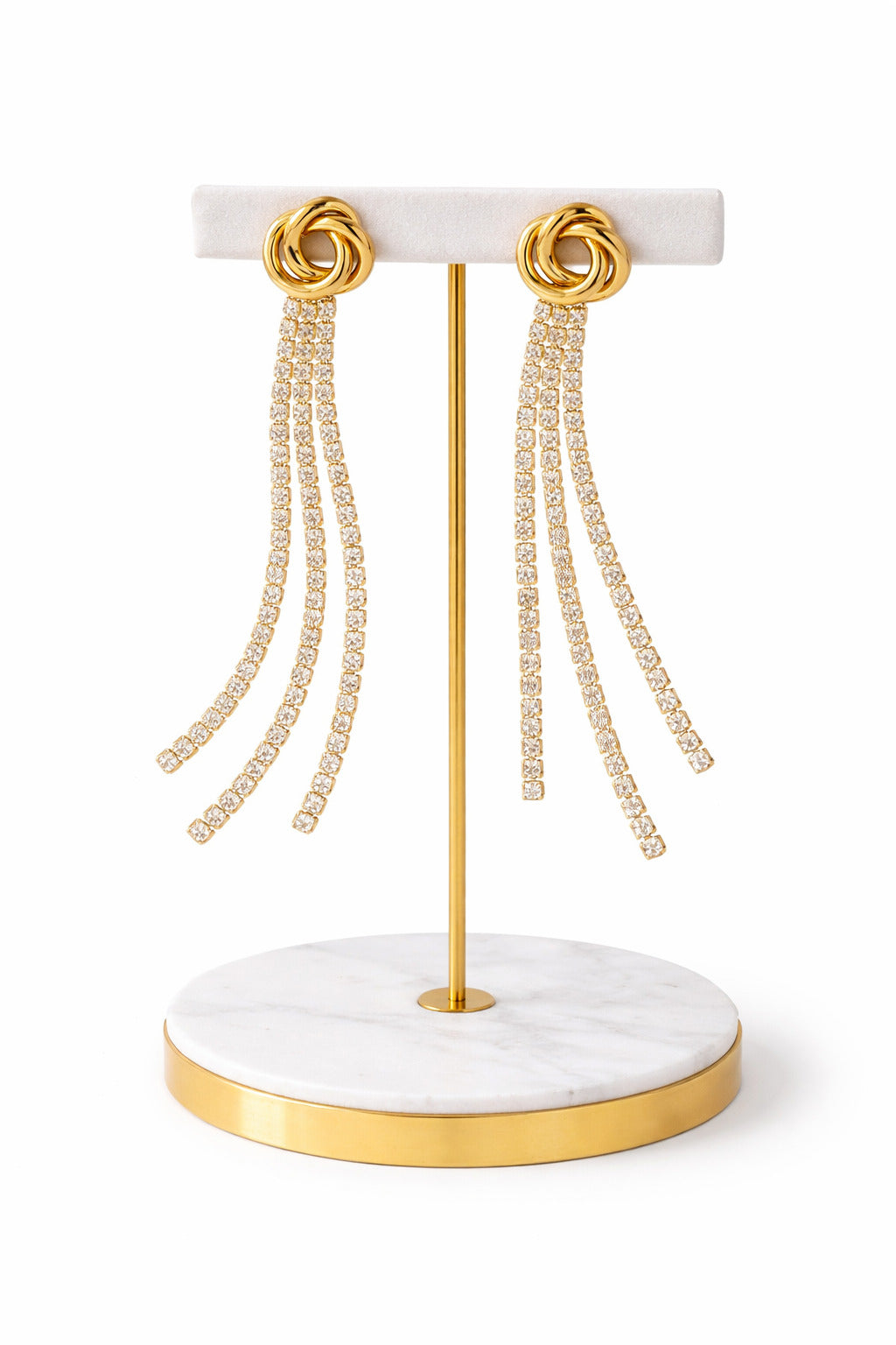 Luxe Knot Drip Earrings: bold gold knot with cascading crystal strands for a glamorous, lightweight look.