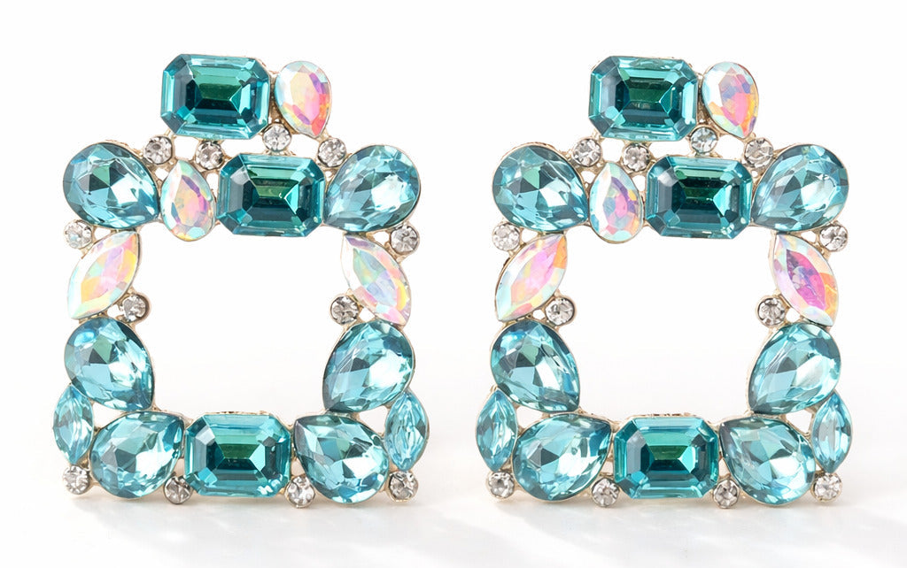 Pair of turquoise gemstone hoop earrings on a white background