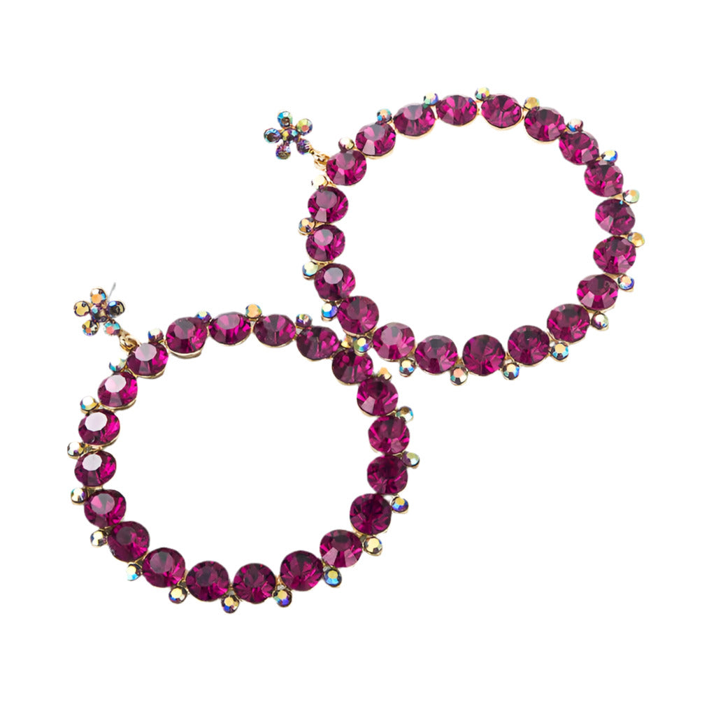 earrings with pink gemstones on a white background