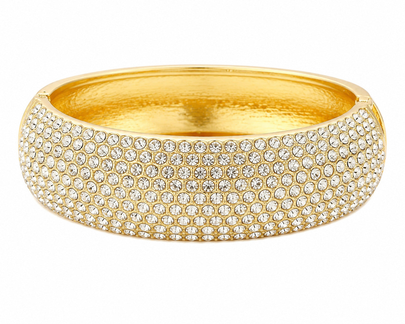 A wide gold bangle bracelet covered in rows of clear pavé gemstones, shown on a plain white background.