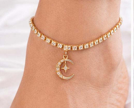 Collage of moon-themed jewelry including anklets, earrings, and a gift box with ribbons.