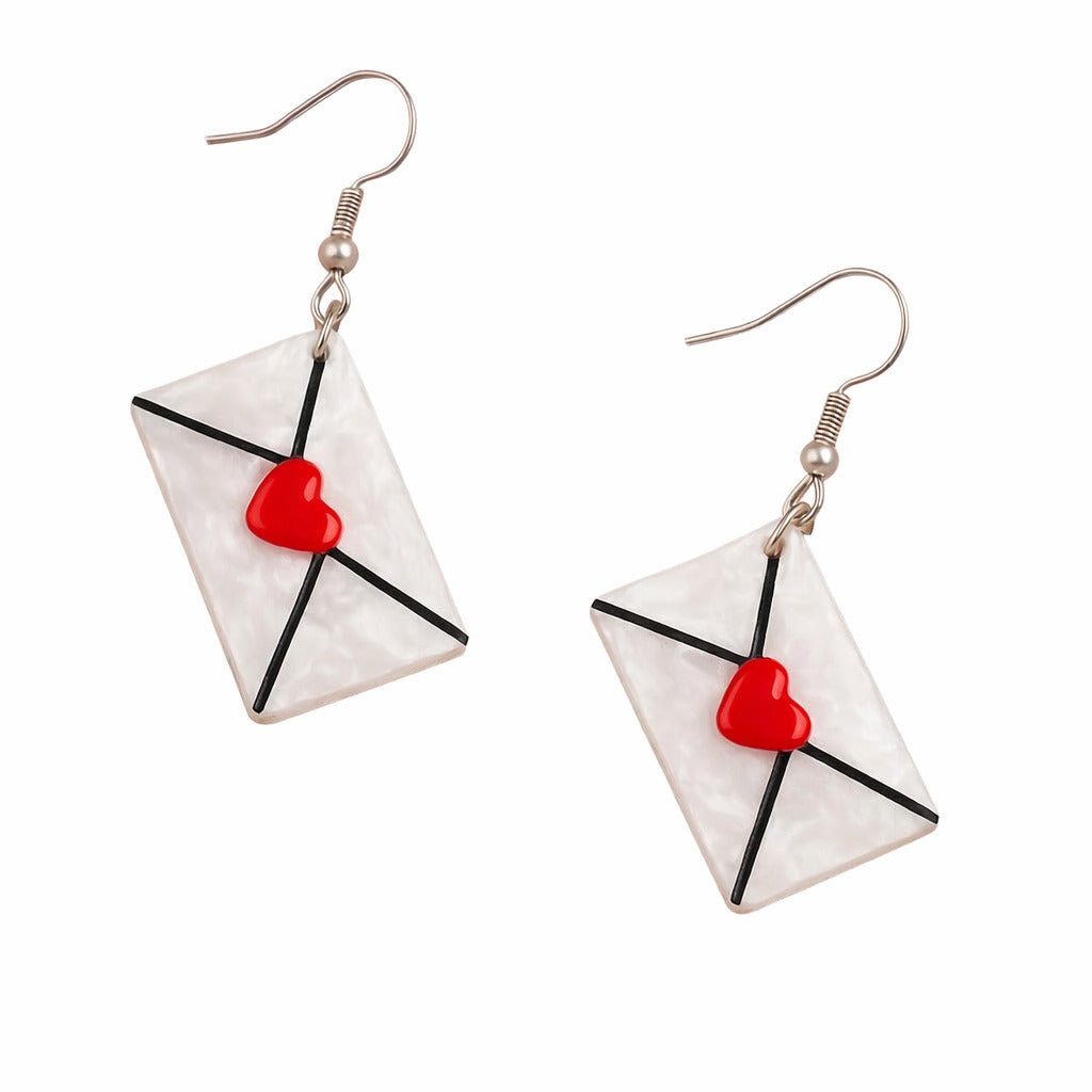 Earrings with envelope and heart design on a white background