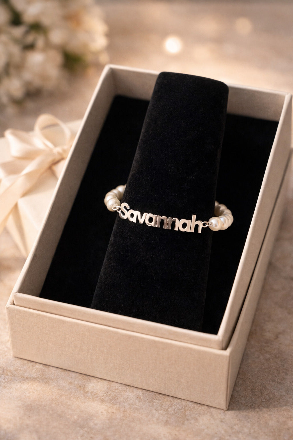 Silver bracelet with 'Savannah' engraving in a jewelry box.