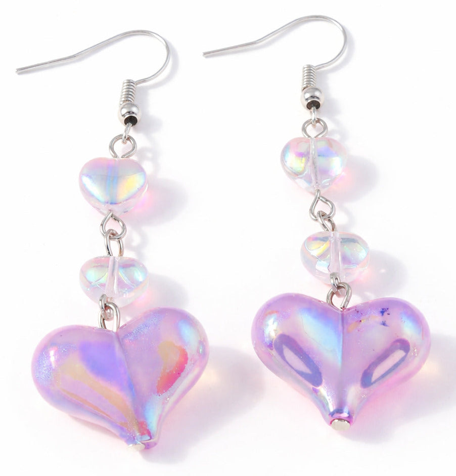 Iridescent heart drop earrings with pink-lavender color-shifting beads and dangling chain.