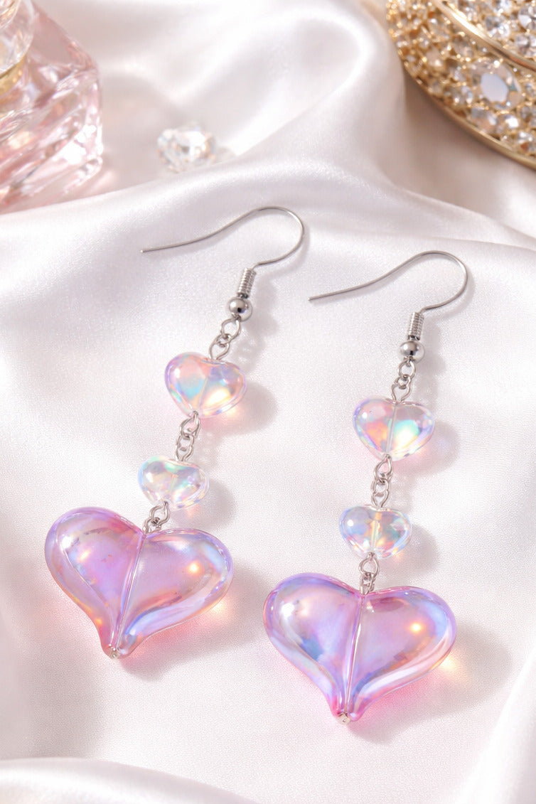 Iridescent Love Glow Earrings with pink-lavender color-shifting heart drops on silver hooks.
