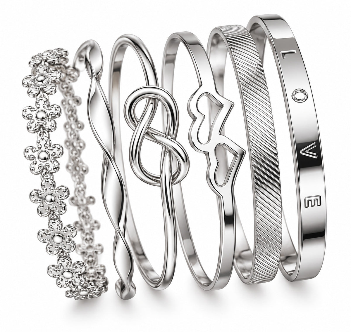 Six silver-toned bangle bracelets arranged together on a white background. The set includes a floral cluster bracelet with clear stones, twisted bands, one with a heart-shaped cutout, one with diagonal textured grooves, and one engraved with the letters 'LOVE' and a small clear stone.