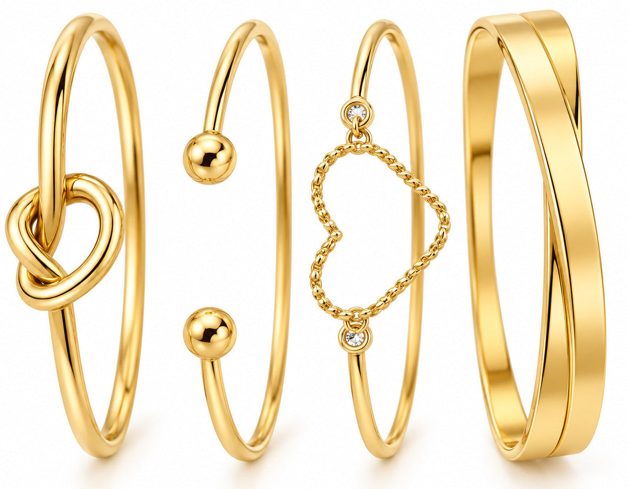 Four gold-toned bangles displayed on a clean white background. The set includes a bangle with a knot detail, an open bangle with ball accents, a delicate chain bangle with a heart-shaped charm and small clear stones, and a thick twisted bangle.