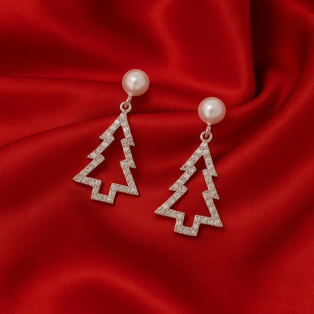 Diamond-studded earrings with pearl tops on a red fabric background