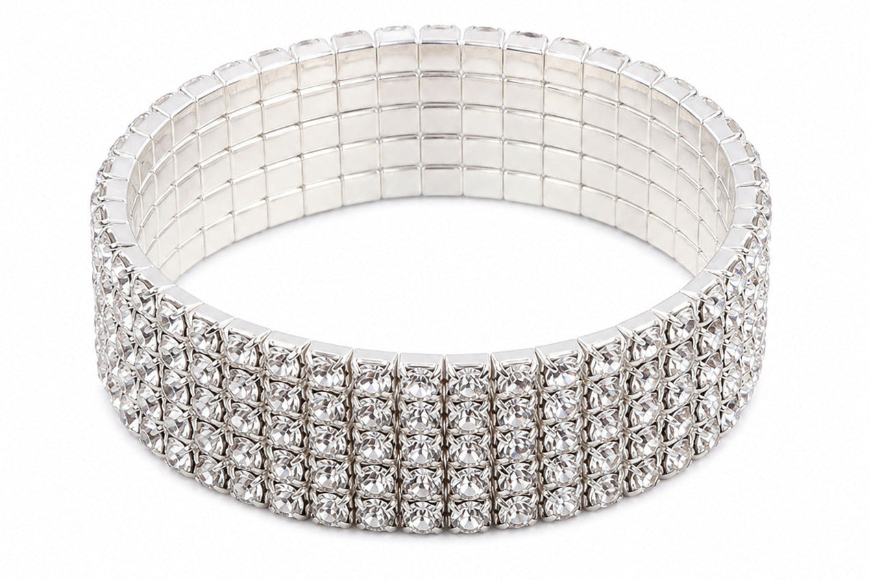 A silver-toned stretch bracelet adorned with three rows of clear rhinestones, displayed on a clean white background.