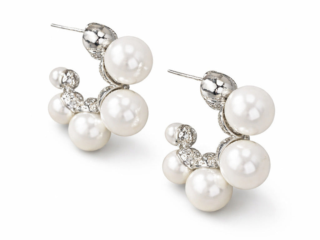 Pair of pearl earrings on a white background