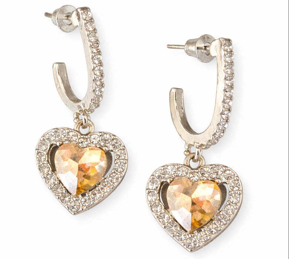 Heart-shaped earrings with crystal centers on a white background