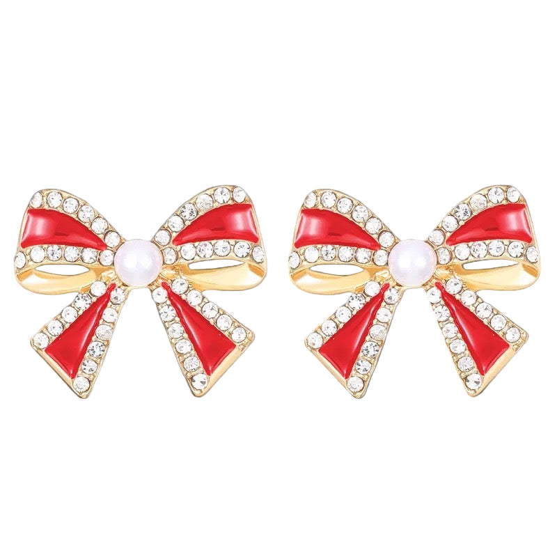 Red bow-shaped earrings with gold accents on a white background