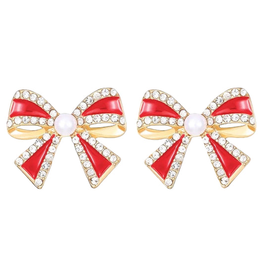 Red bow-shaped earrings with gold accents on a white background