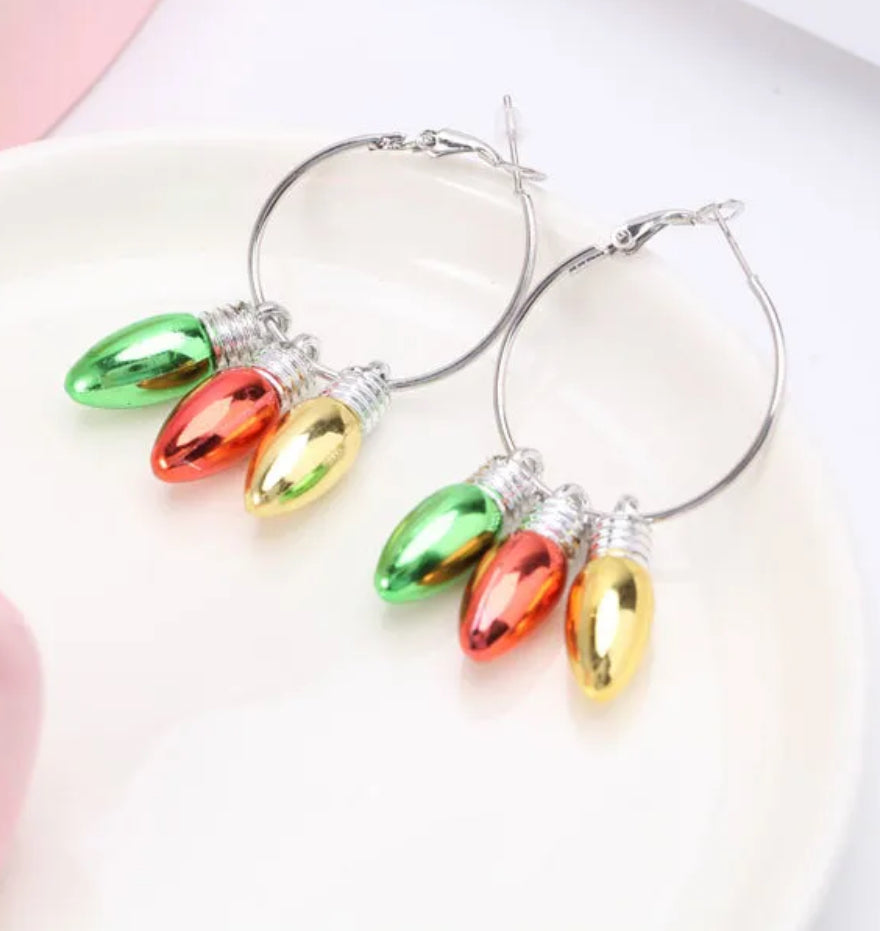 Hoop earrings with colorful bulb charms on a white background