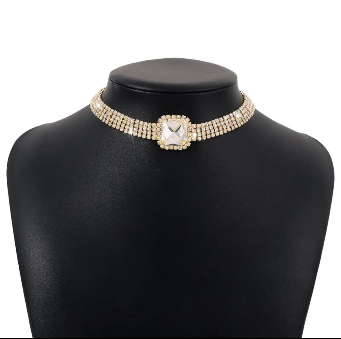 Necklace with a square gemstone on a black mannequin bust