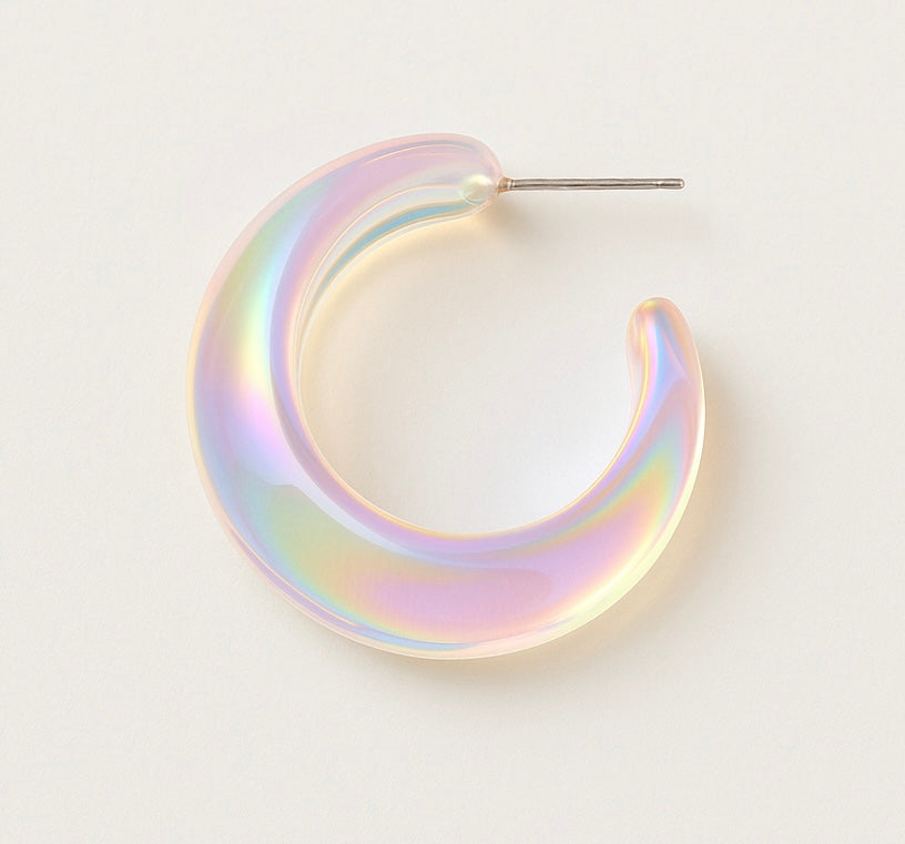 Iridescent hoop earring on a light gray background