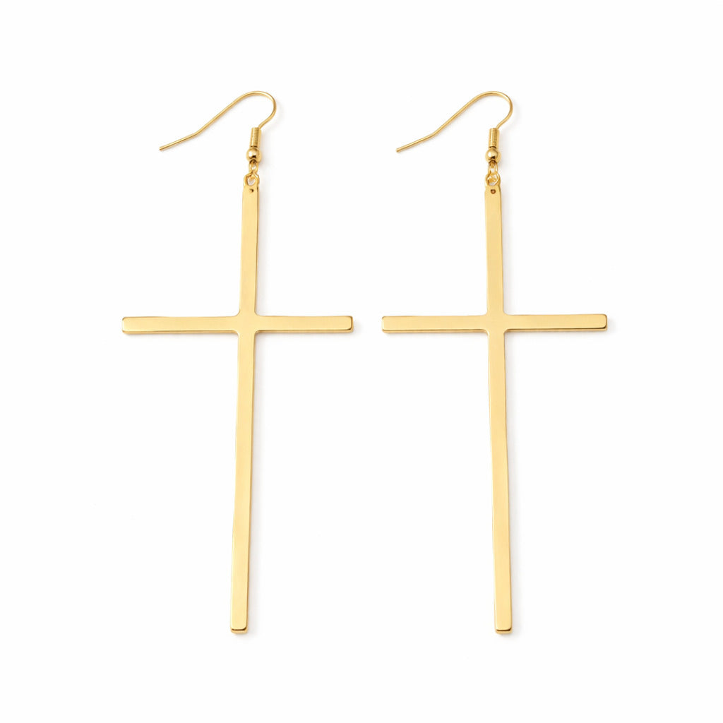 Gold cross-shaped earrings on a white background