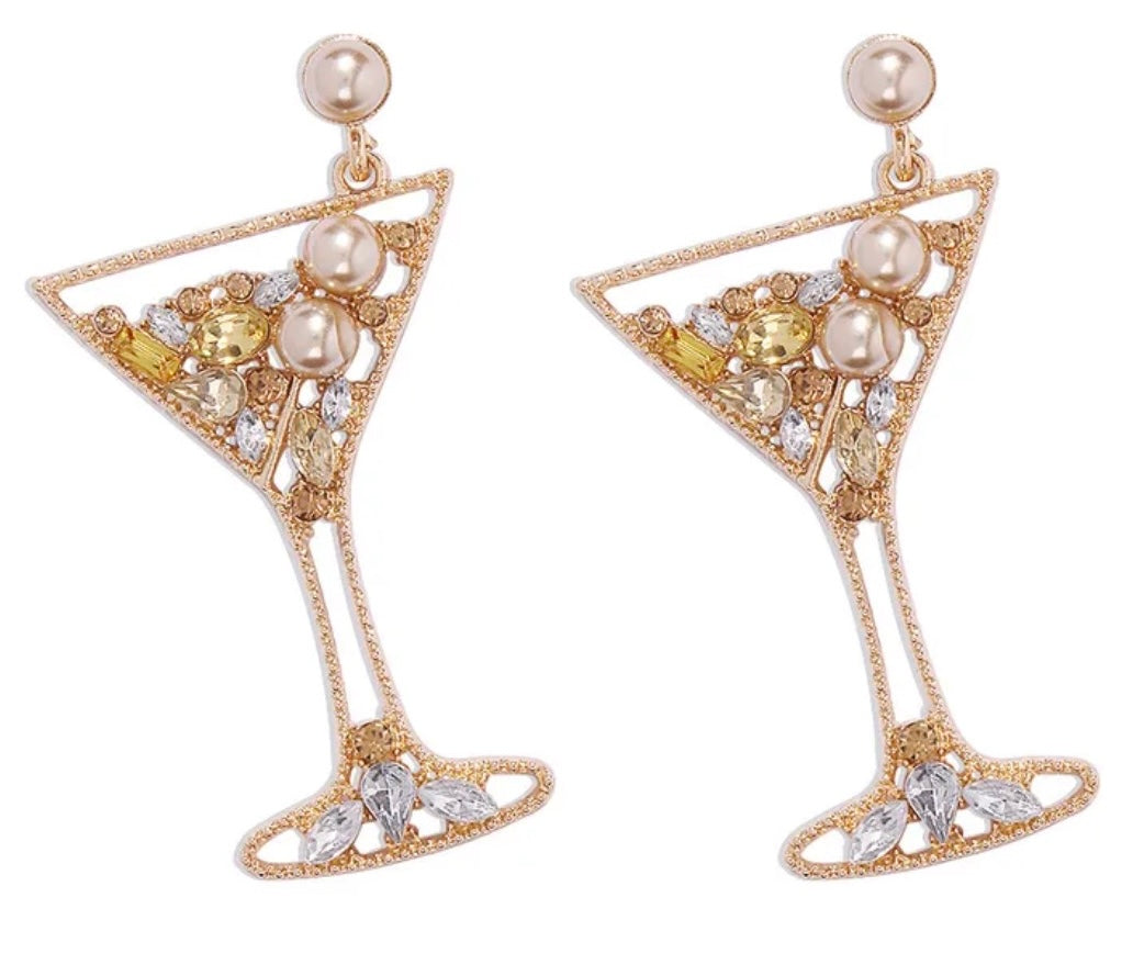 Gold martini glass-shaped earrings with pearls and crystals on a white background