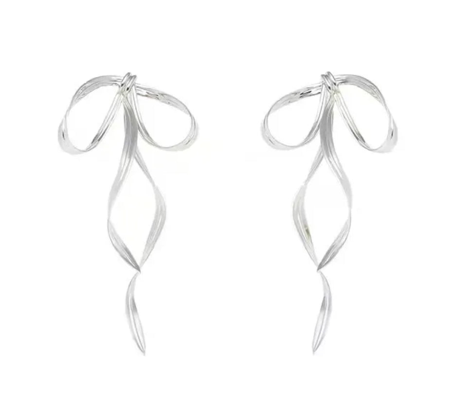 Silver earrings with a ribbon design on a white background