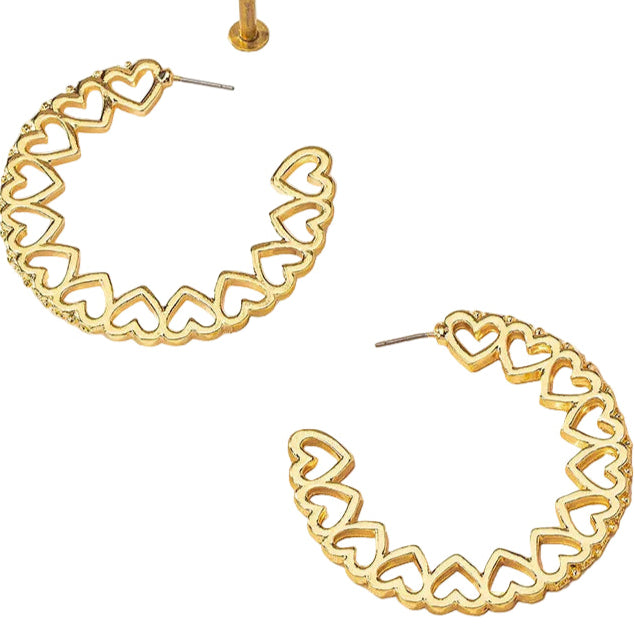 Gold hoop earrings with heart designs on a white background