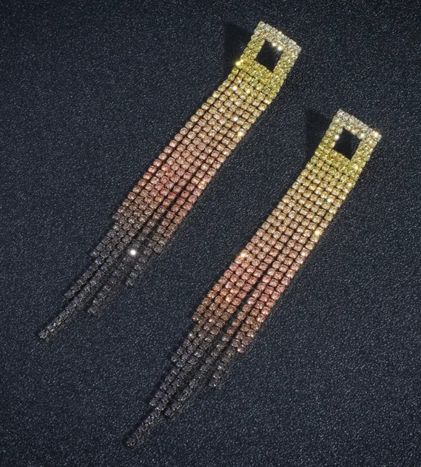 Two decorative rhinestone straps on a dark background