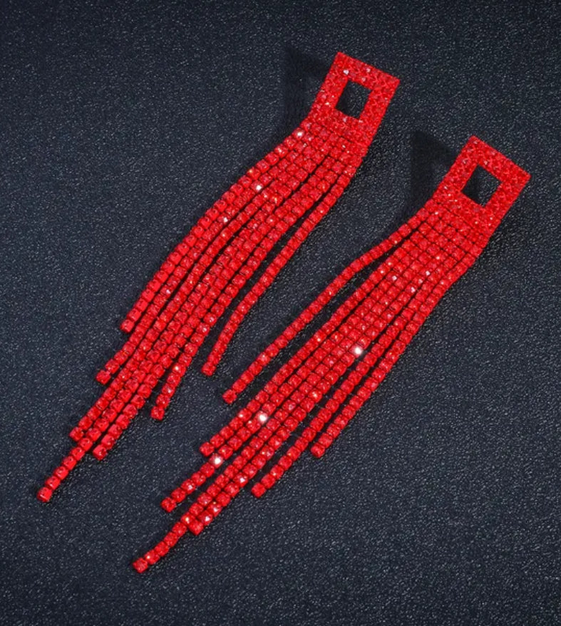 Two red beaded straps on a black background