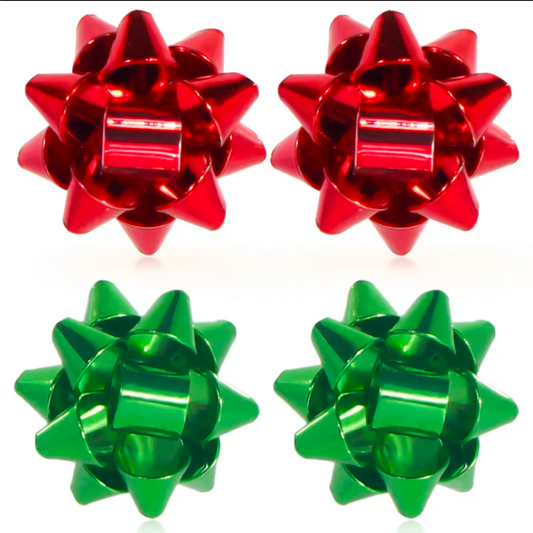 Two red and two green metallic gift bows on a white background