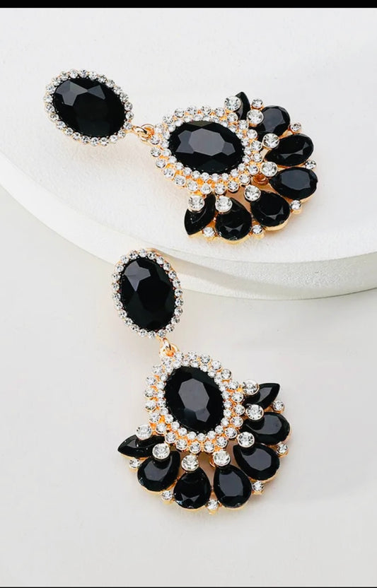 Pair of black gemstone earrings on a white background