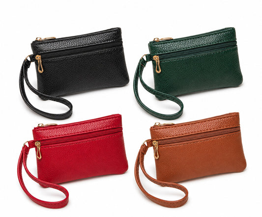 Four small handbags in black, green, red, and brown on a white background