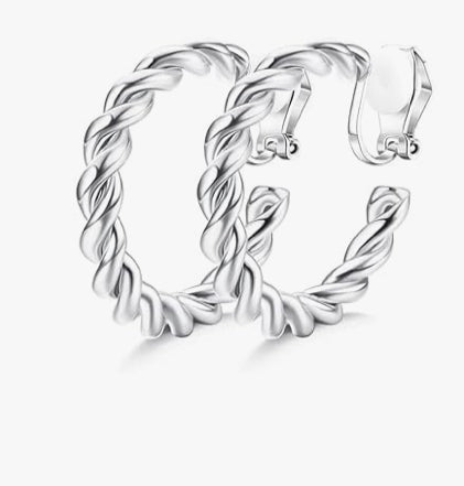 Pair of silver hoop earrings with twisted design on a white background