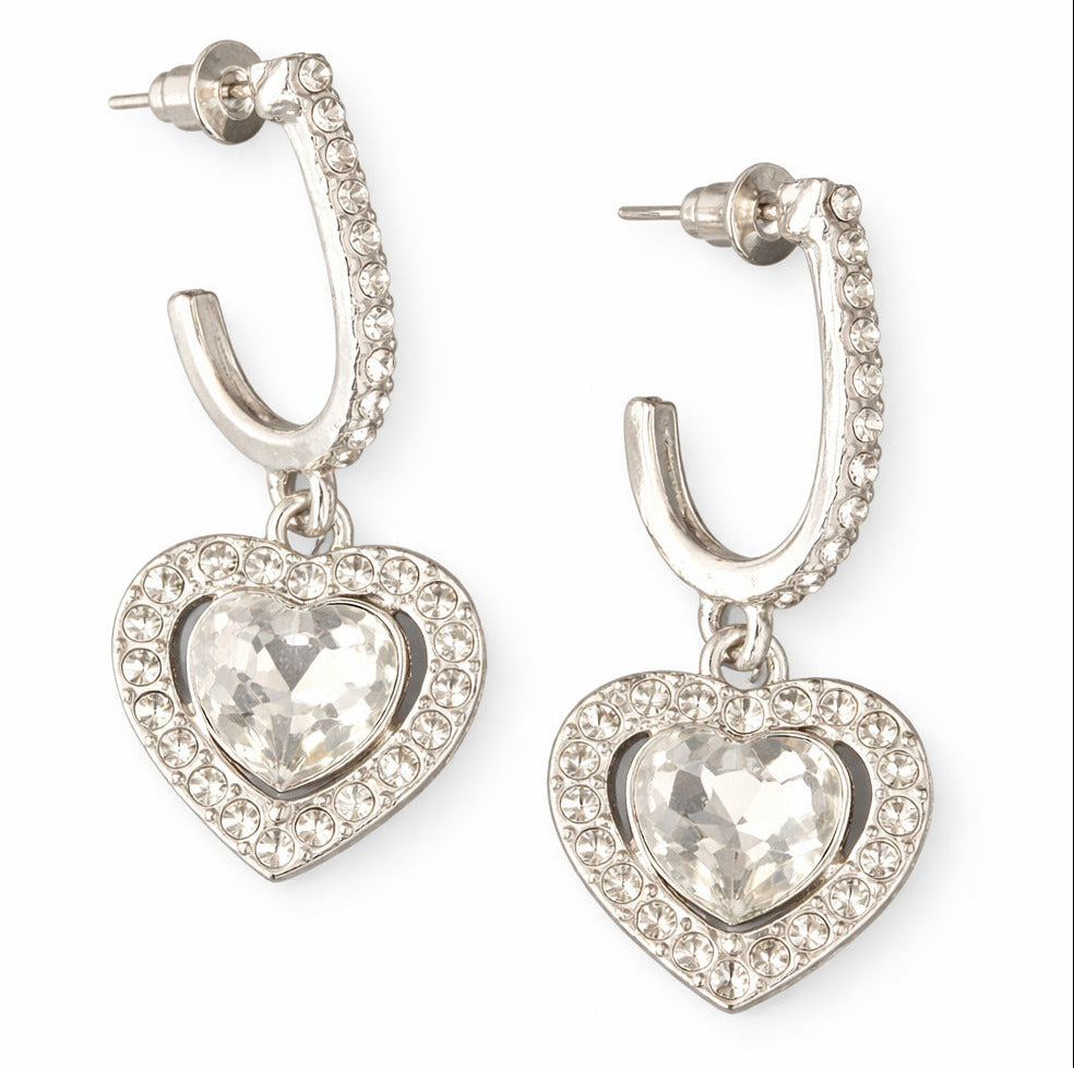 Heart-shaped earrings with clear gemstones on a white background
