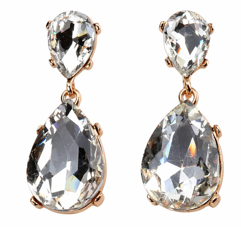 Pair of teardrop-shaped earrings with clear gemstones on a white background