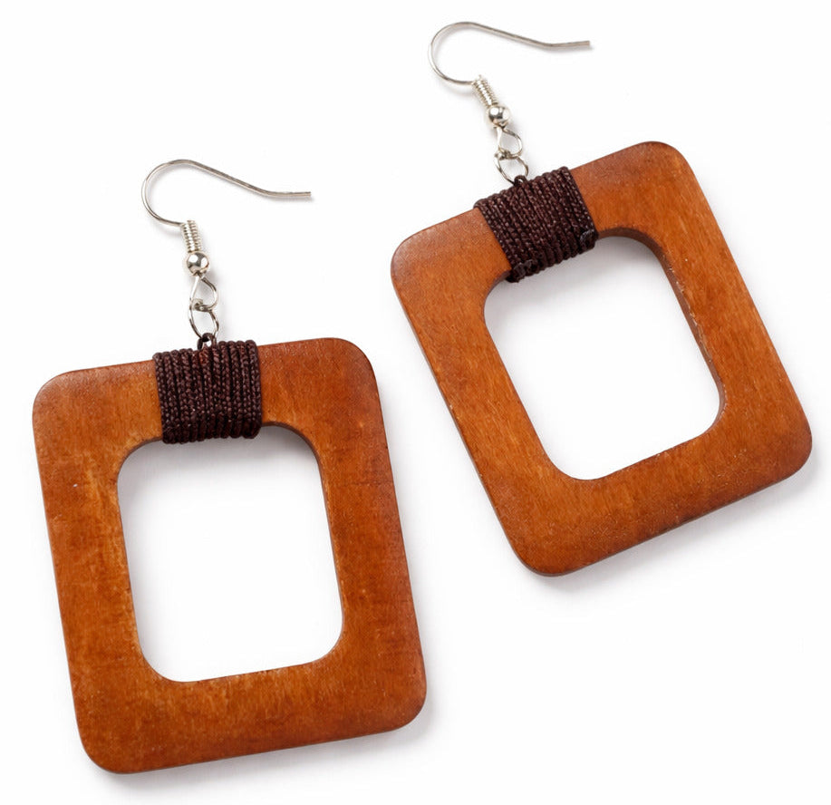 square Wooden square earrings with brown string on a white background