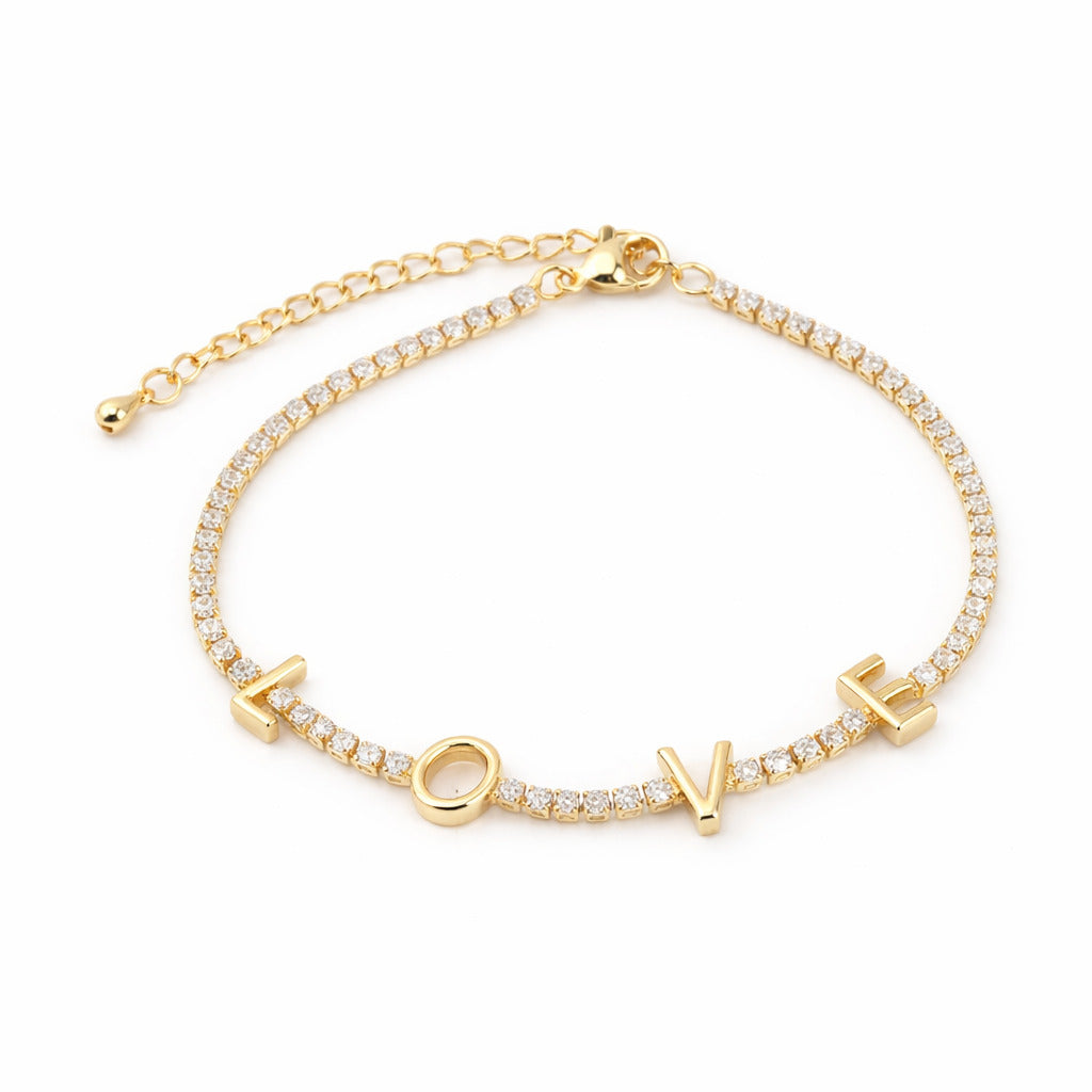Gold bracelet with 'LOVE' letters on a white background