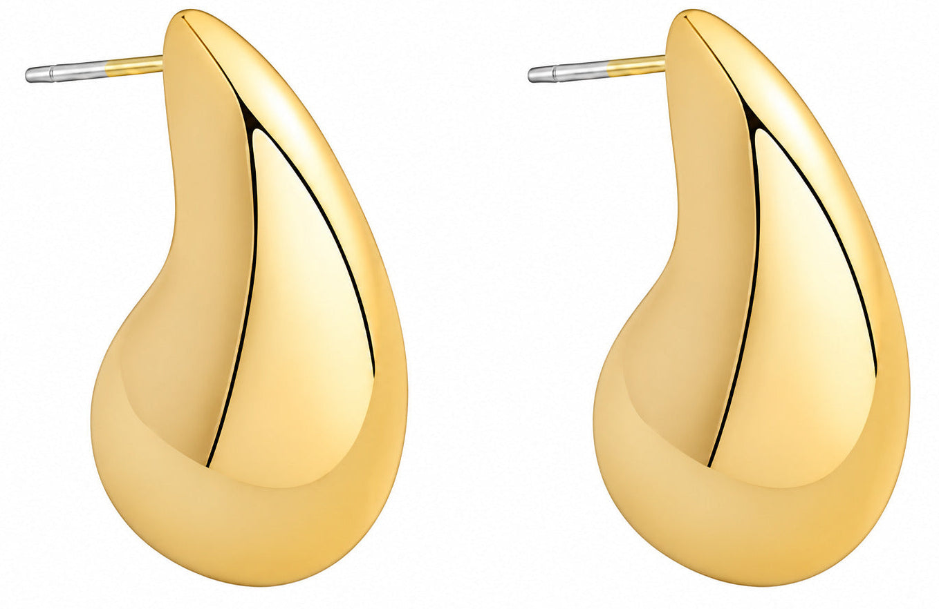 Gold teardrop earrings on a white background