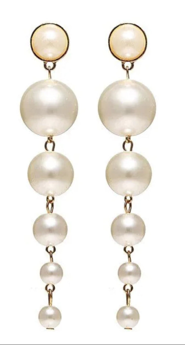 Pair of pearl earrings on a white background