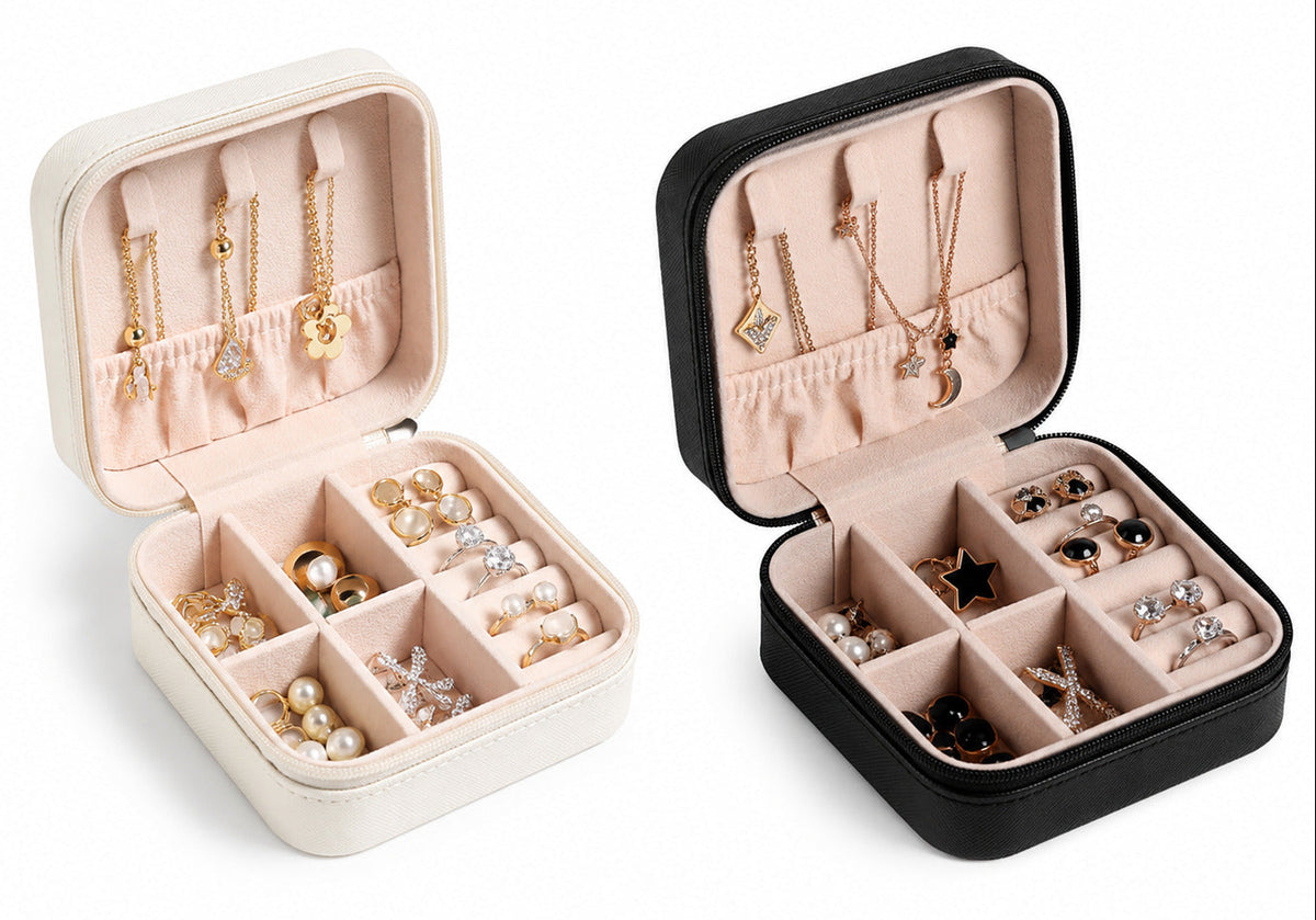Two jewelry cases, one beige and one black, filled with necklaces and earrings on a white background.