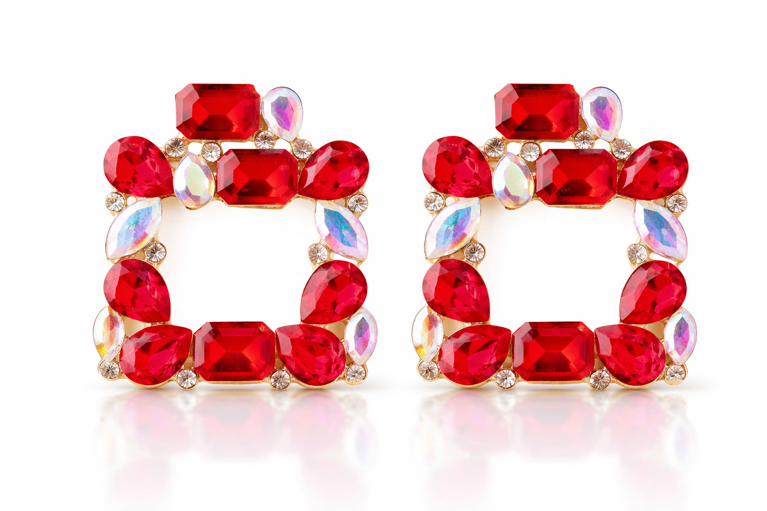 Pair of red gemstone earrings on a white background