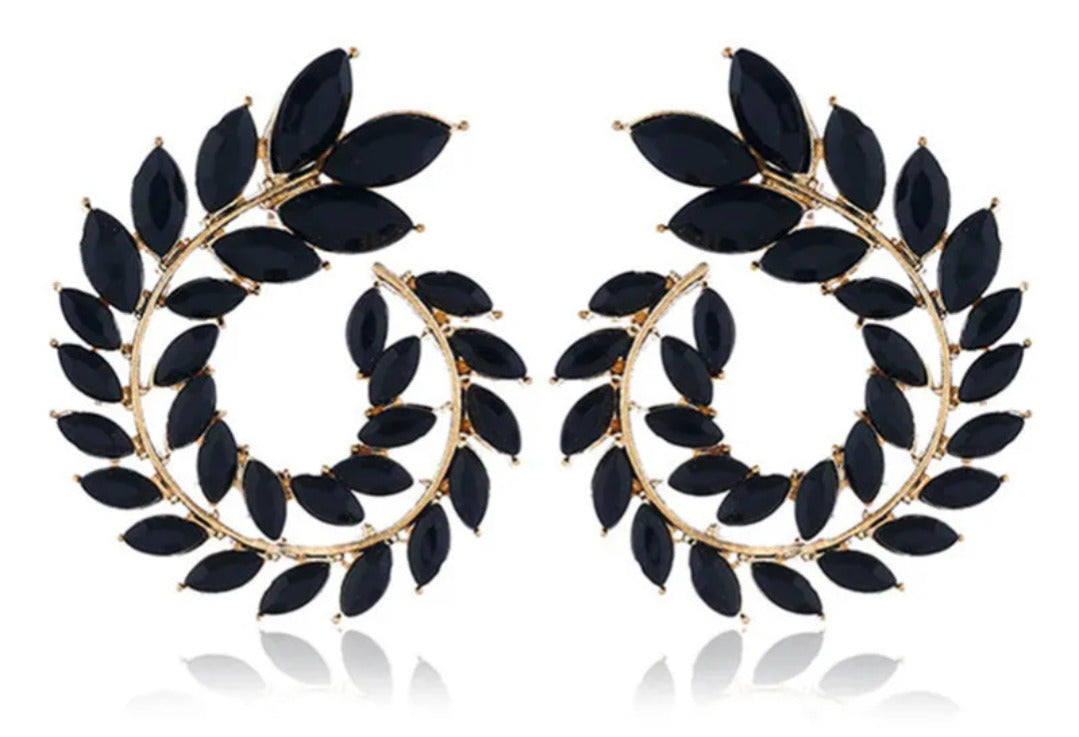 Pair of black leaf-shaped earrings with gold hoop design on a white background