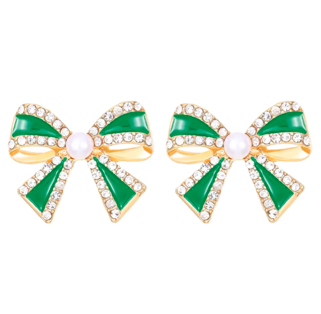 Green bow-shaped earrings with gold accents on a white background