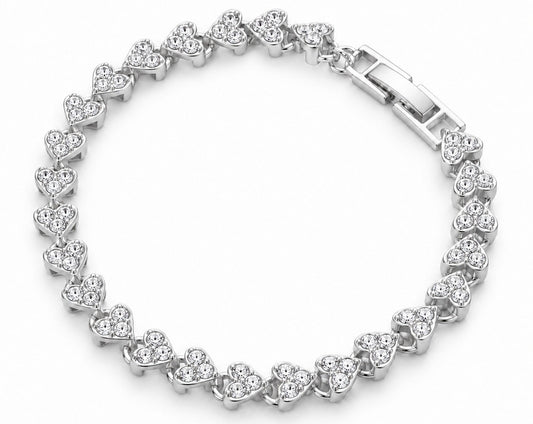 A silver heart-link tennis bracelet with clear heart-shaped gemstones, shown on a plain white background.